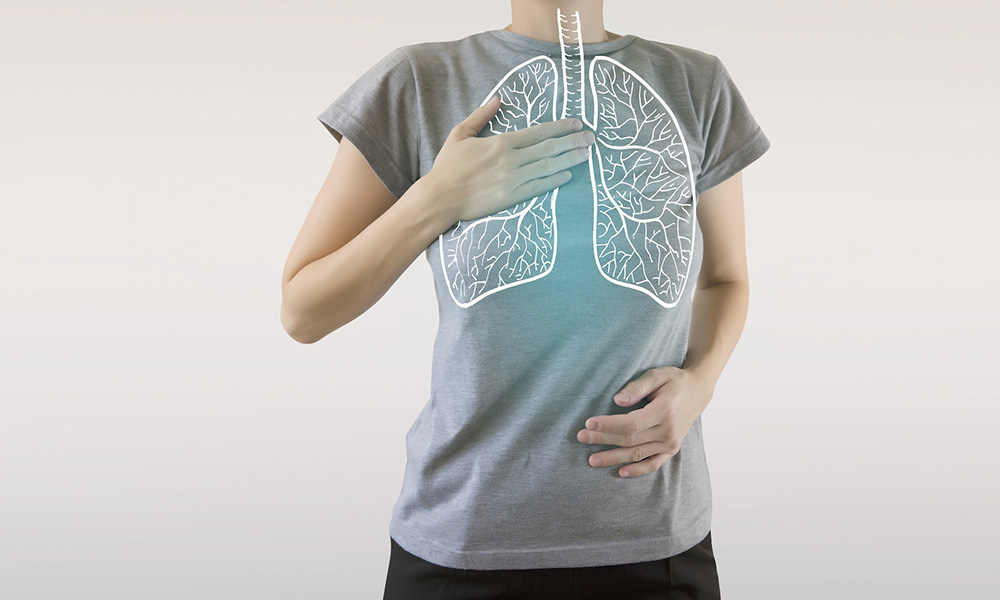 Photo of person with a t-shirt with a graphical representation of lungs on it